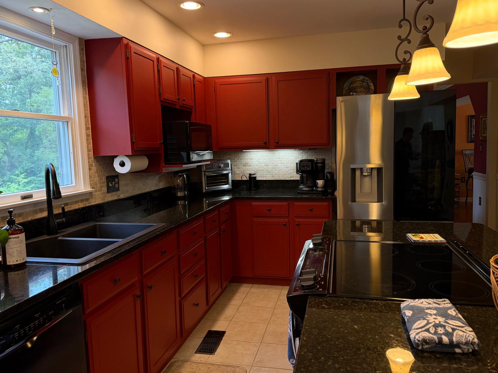Clean kitchen with red cabinets